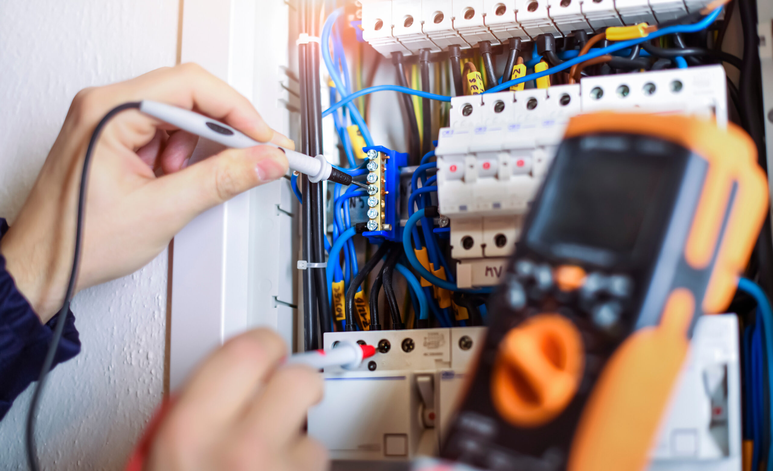 Electrician,Installing,Electric,Cable,Wires,And,Fuse,Switch,Box.,Multimeter