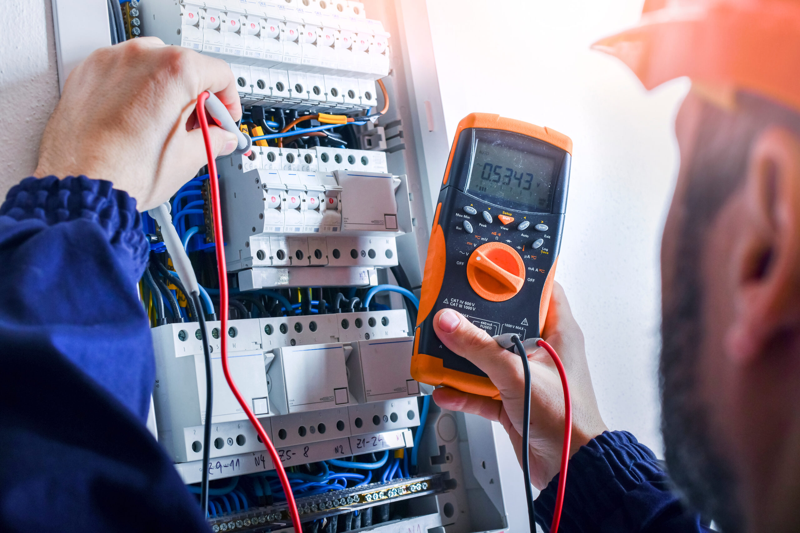 Electrician,Installing,Electric,Cable,Wires,And,Fuse,Switch,Box.,Multimeter