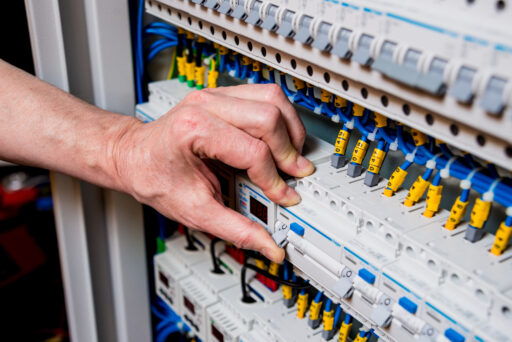 The,Man,Is,Repairing,The,Switchboard,Voltage,With,Automatic,Switches.