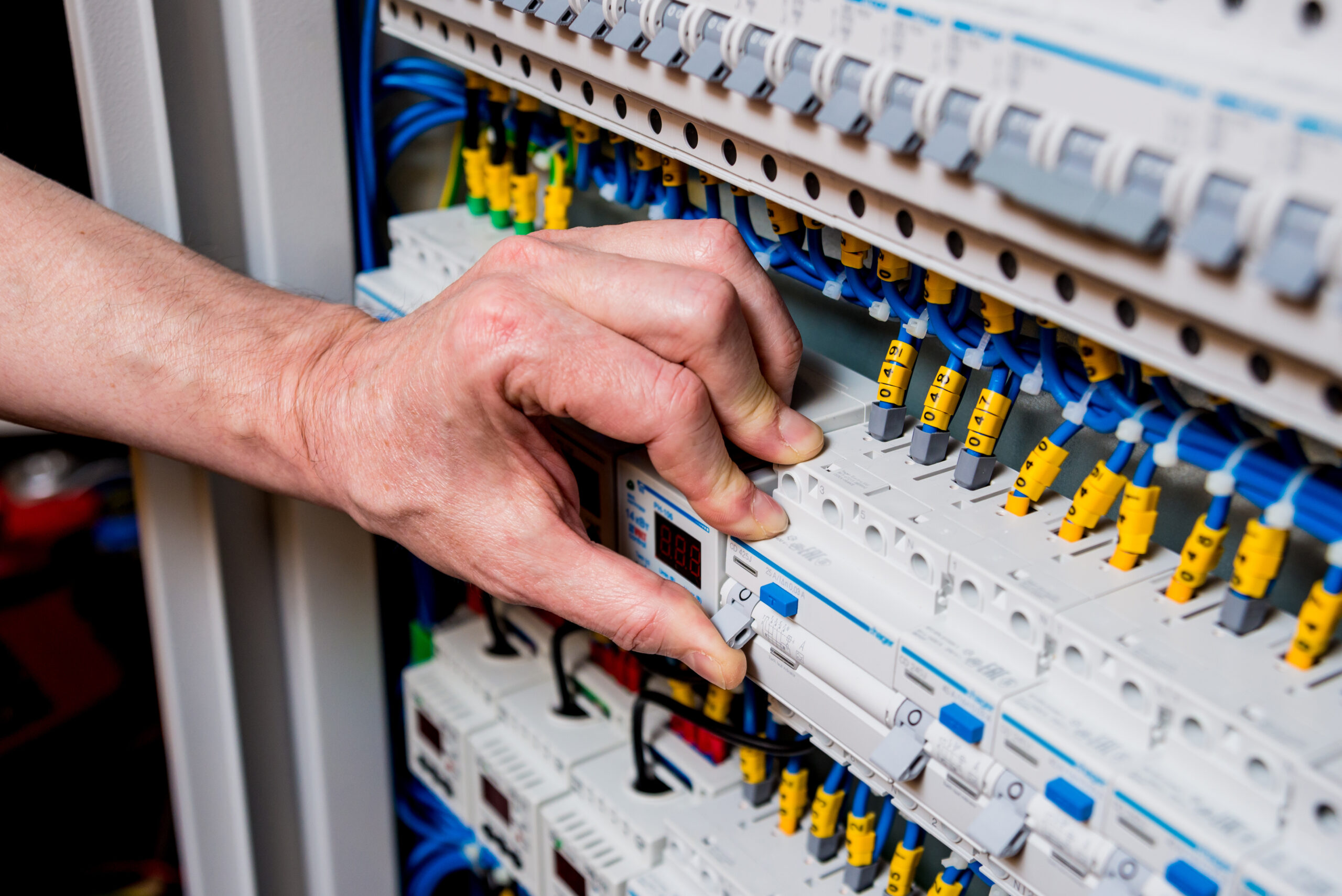 The,Man,Is,Repairing,The,Switchboard,Voltage,With,Automatic,Switches.